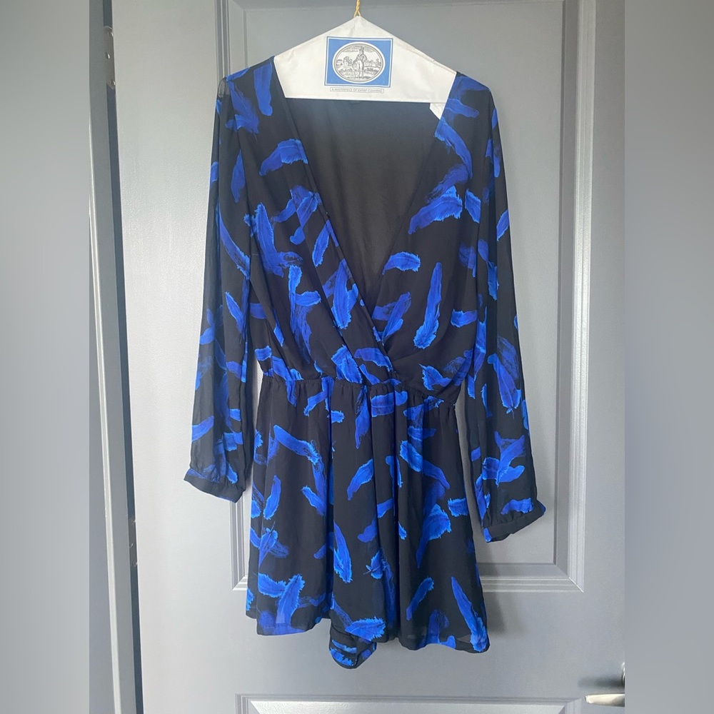 Express black with blue feather print romper. Size m. Clasp to close front.